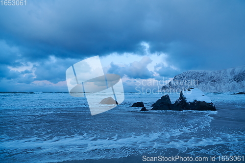 Image of norway coast in winter with snow bad cloudy weather