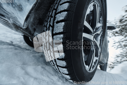 Image of offroad suv car on icy winter north road