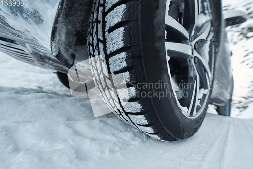 Image of offroad suv car on icy winter north road