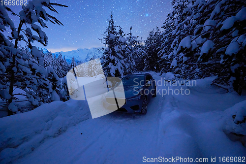 Image of offroad suv car on icy winter north road