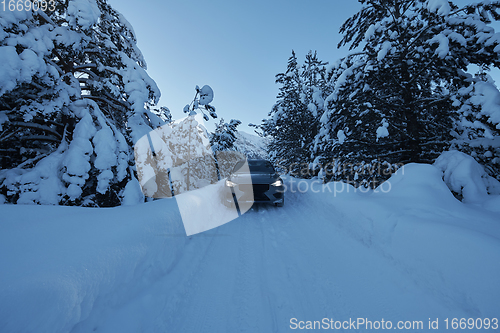 Image of offroad suv car on icy winter north road