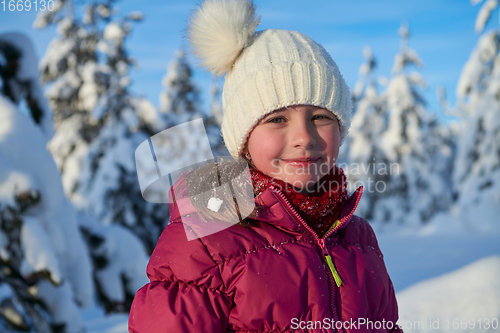 Image of cute little girl on beautiful winter day