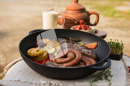 Image of Grilled sausages with vegetables