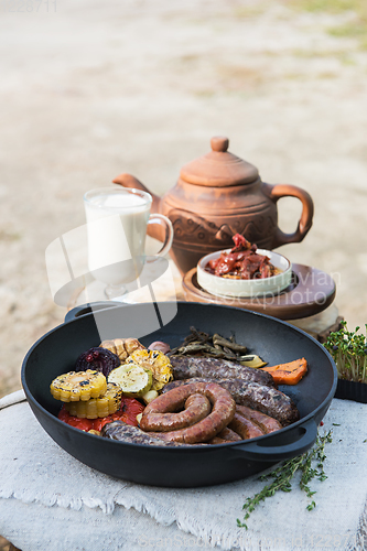 Image of Grilled sausages with vegetables