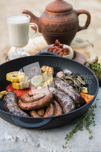 Image of Grilled sausages with vegetables