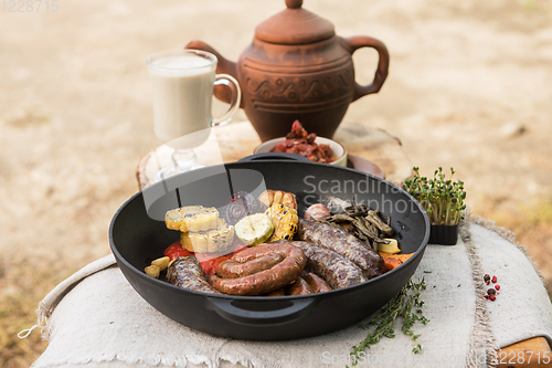 Image of Grilled sausages with vegetables