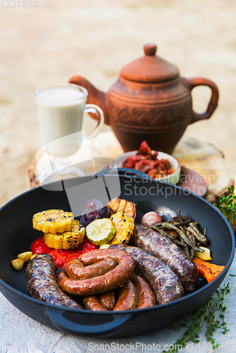 Image of Grilled sausages with vegetables