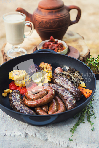 Image of Grilled sausages with vegetables
