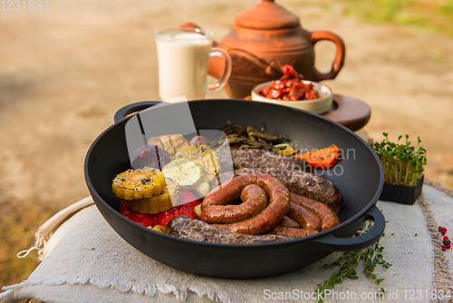 Image of Grilled sausages with vegetables