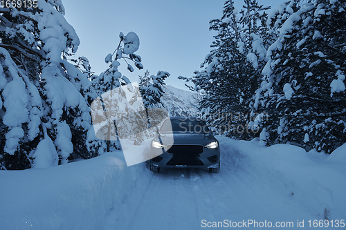 Image of offroad suv car on icy winter north road