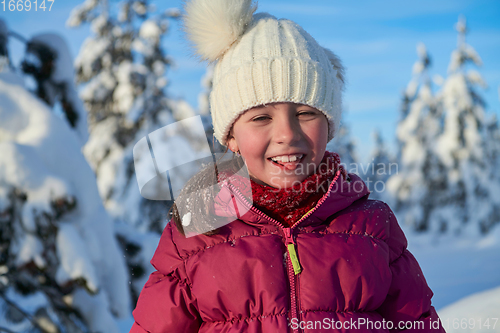 Image of cute little girl on beautiful winter day