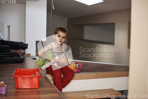 Image of Little boy child playing with creative toys