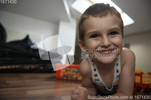 Image of Little boy child playing with creative toys