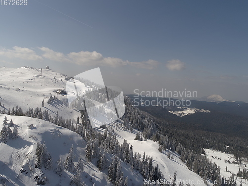 Image of sunny winter day with fresh snow in ski resort