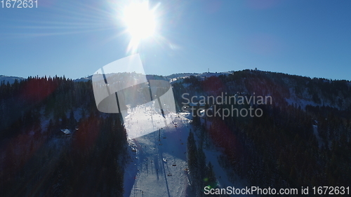 Image of sunny winter day with fresh snow in ski resort