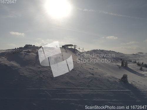 Image of sunny winter day with fresh snow in ski resort