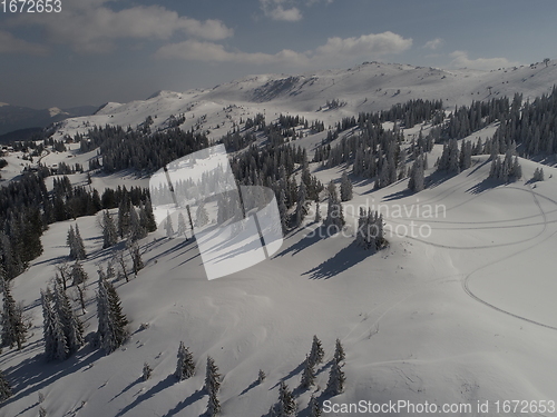 Image of sunny winter day with fresh snow in ski resort