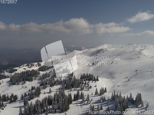 Image of sunny winter day with fresh snow in ski resort