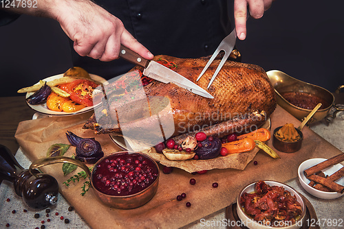 Image of Roasted goose with herbs berries and vegetables