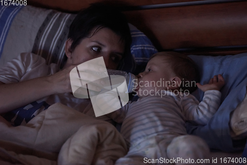 Image of baby eating milk from bottle