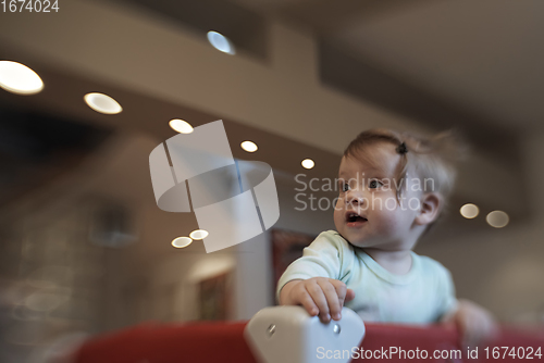 Image of cute little baby playing in mobile bed