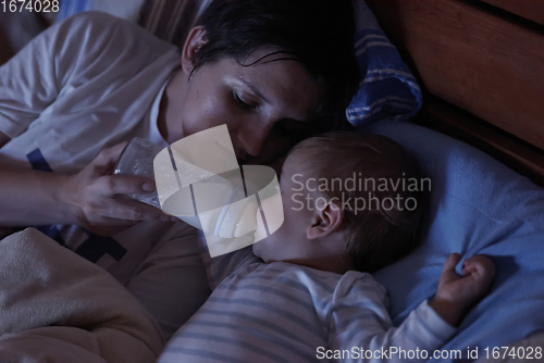 Image of baby eating milk from bottle