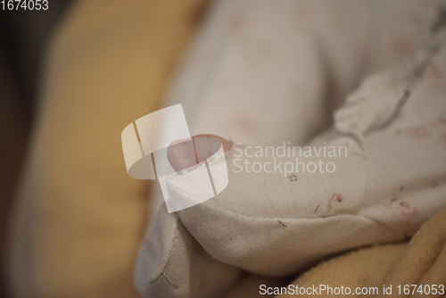 Image of One month newborn baby sleeping in bed