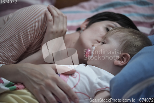 Image of mother is playing with baby at home