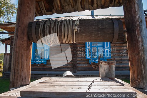 Image of Wooden retro well in garden