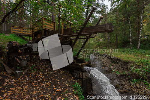 Image of Rustic watermill with wheel