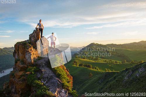 Image of Happy man and woman on top mountain