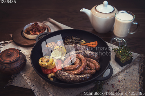 Image of Grilled sausages with vegetables