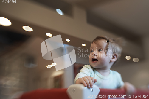 Image of cute little baby playing in mobile bed