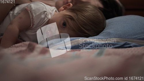 Image of mother is playing with baby at home