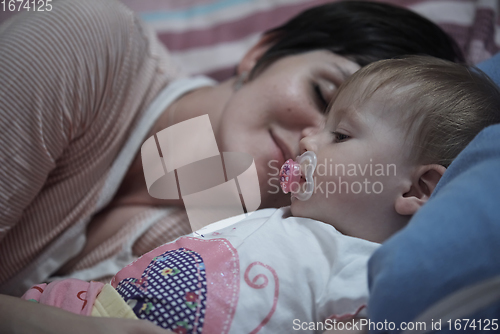 Image of mother is playing with baby at home