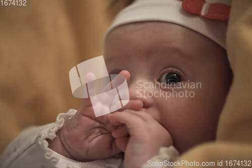Image of portrait of happy newborn little baby smilling