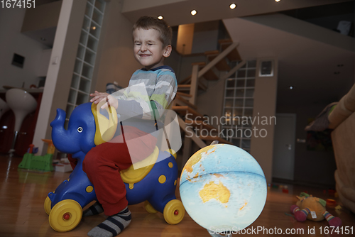 Image of Little boy child playing with creative toys