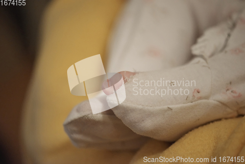 Image of One month newborn baby sleeping in bed