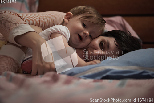 Image of mother is playing with baby at home