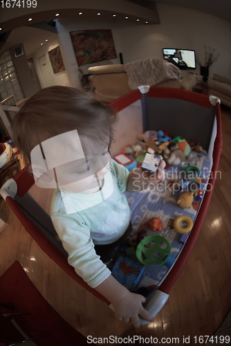 Image of cute little baby playing in mobile bed