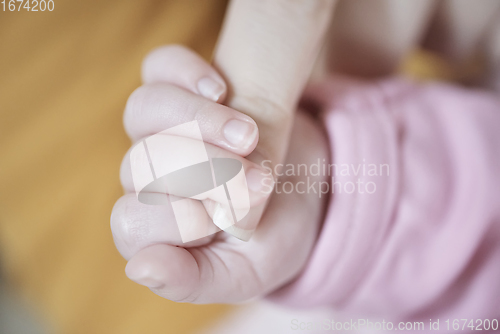 Image of mother is playing with baby at home