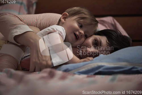 Image of mother is playing with baby at home