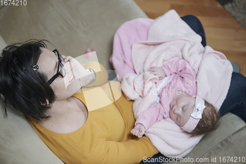 Image of mother is playing with baby at home