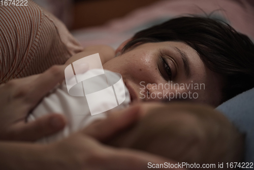 Image of mother is playing with baby at home