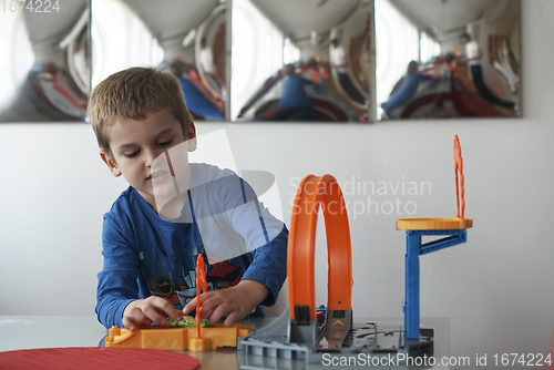 Image of Father and children playing car toy game