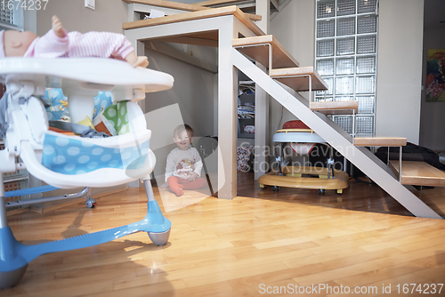 Image of cute little one year old baby and making first steps