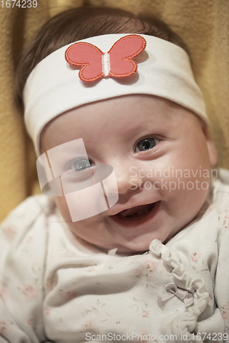 Image of portrait of happy newborn little baby smilling