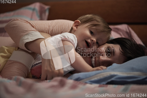 Image of mother is playing with baby at home