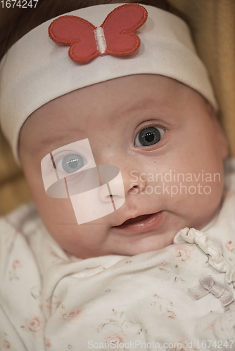 Image of portrait of happy newborn little baby smilling