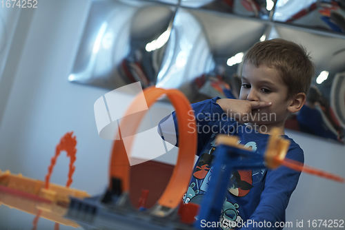 Image of Father and children playing car toy game